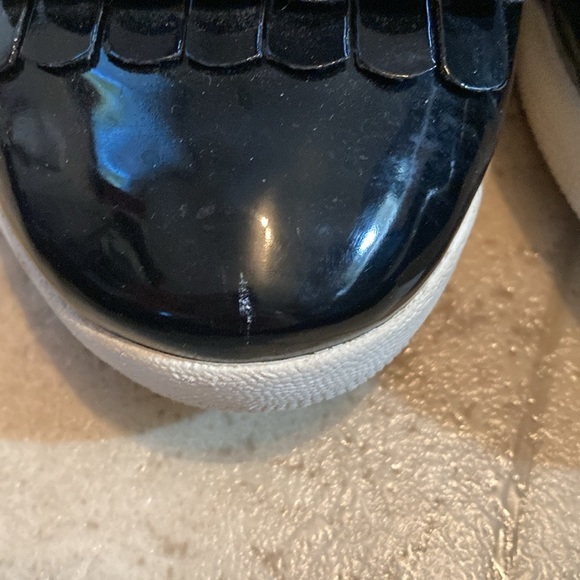 Fit flip black shiny frilly loafers style black shed with small mark on one toe. - Picture 3 of 10